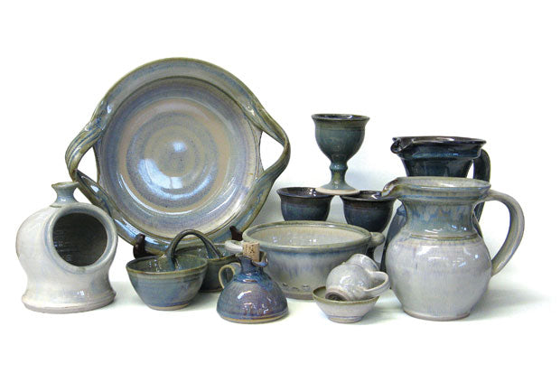 collection of hand thrown plates, jugs and goblets